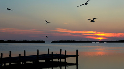 Fototapeta premium Small beautiful pier in the Keys of Florida at sunset