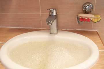 water in the sink with foam