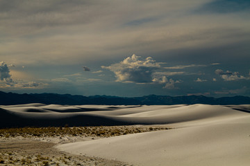 Clouds approach the sand dunes 
