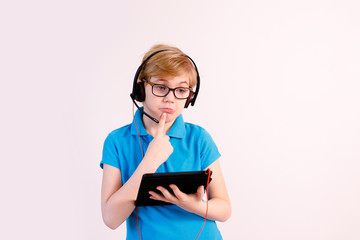 Boy studying homework during his online lesson at home, social distance during quarantine....