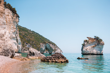 Mattinata Faraglioni stacks and beach coast of Mergoli, Vieste Gargano, Apulia, Italy.