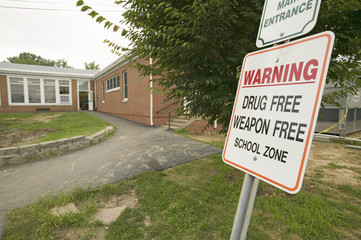 A grade school displays sign stating it's a "Drug Free and Weapon Free" school zone, Clark School, Webster Groves, Missouri