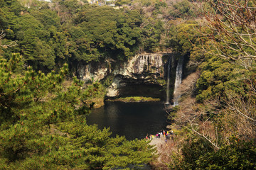Fototapeta na wymiar Cheonjiyeon Falls - Jeju Olle Trail Route 7 : Beautiful Scenery of Jeju Island, Korea