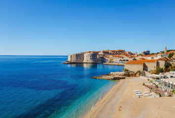Beautiful landscape view of old town Dubrovnik, sand beach and blue Adriatic sea