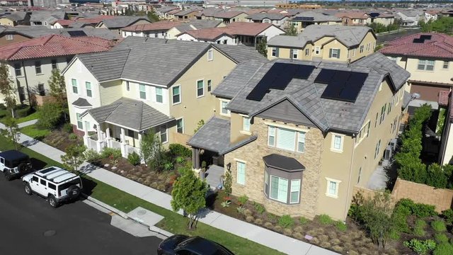 Modern House With Solar Photovoltaic Panels Array on Rooftop in Los Angeles Upscale Suburbia, Aerial