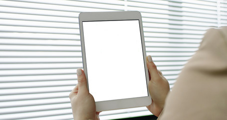Mockup image of woman hands holding digital tablet with blank white screen