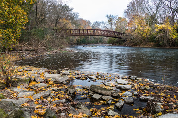 Red footbridge over the Tulpehocken Creek in autumn