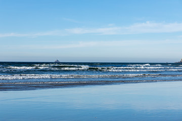 Lighthouse with waves west coast