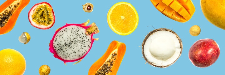 Creative layout made of passion fruit, pitahaya, mango, orange, papaya, coconut, longan. Flat lay....