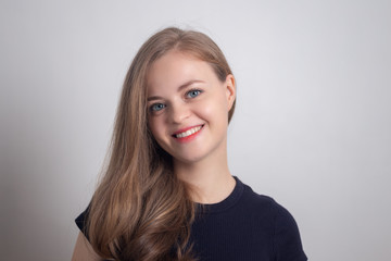 Naklejka premium Smiling young caucasian girl woman, looking happy and positive