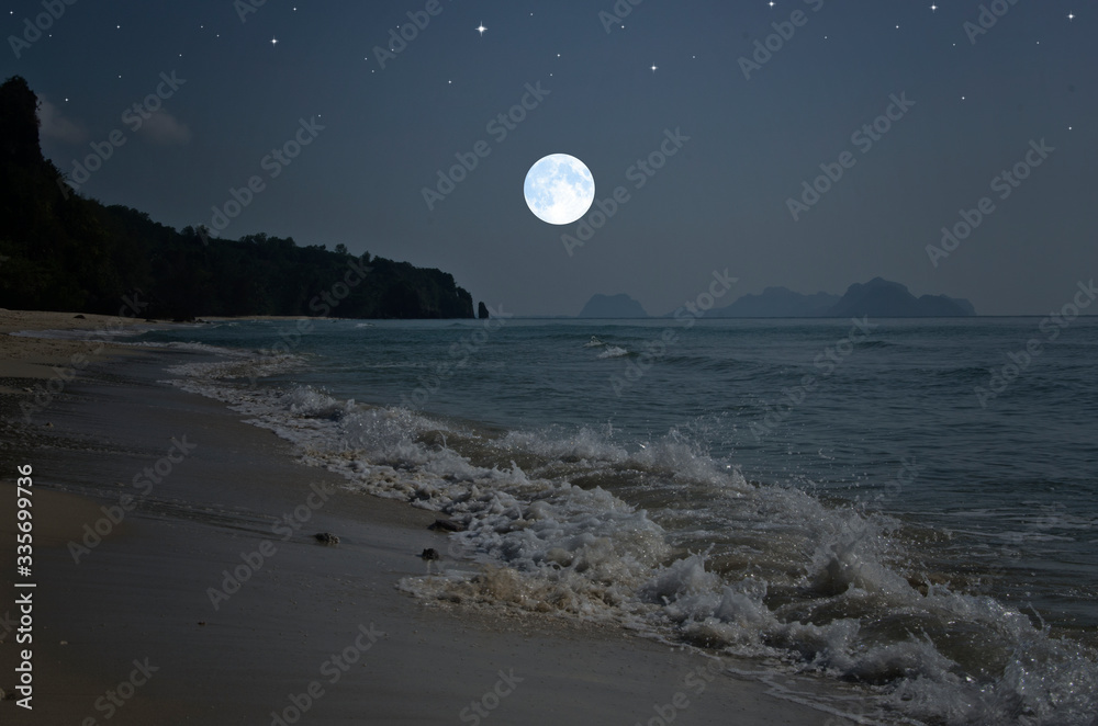 Wall mural Full moon falls down over the sea in early morning - Wall murals