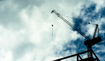 Construction crane on high rise building