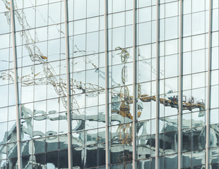 Obraz premium Modern office buildings with glass facade reflecting their surroundings 