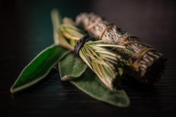 Closeup of Fresh & Dried Sage Native American Smudging Wiccan Bundles With Braided Sweet Grass...