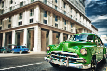 Old vintage car parked on the street of havana city - 335702136