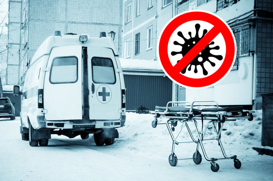 medical stretcher near to ambulance with open doors on the street with image of coronavirus covid-19 above. concept of stopping a dangerous infection - image