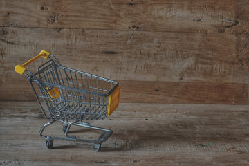 shopping cart on wooden background shopping basket-1