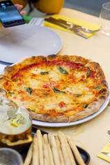 Margherita pizza with basil and cheese