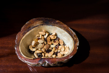 Mixed nuts in a coconut bowl. 