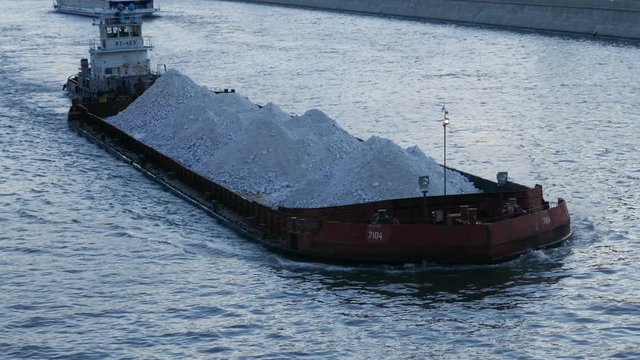 Sand carrier ship great lakes bulk freighter transporting cargo in river