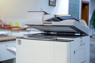 The photocopier or network printer is office worker tool equipment for scanning and copy paper.