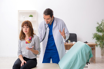 Young woman visiting male doctor cardiologist
