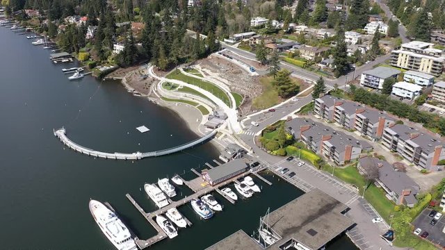 Aerial / drone footage of Meydenbauer Bay Park, beach park, marinas with waterfront mansions in Belleview near Seattle, Washington during the COVID-19 pandemic