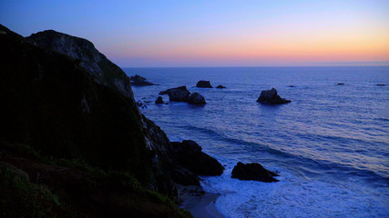 Pacific Ocean at the coast of Big Sur - evening view after sunset