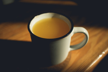 Fresh orange drink on wooden tea table in the morning.