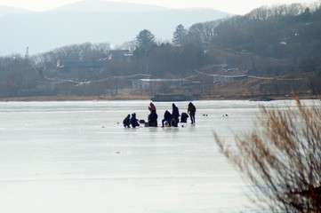 winter fishing men