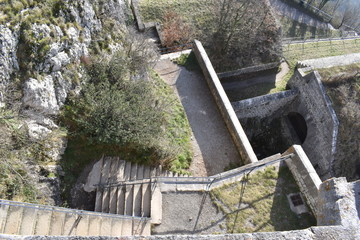 The old stone staircases of the Bastille fortress in grenoble. Stairs leading up to the top of the ancient fortress of bastille on Chartreuse mountain.