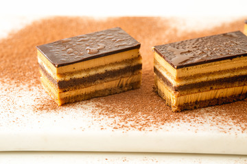 Chocolate cake with coffee mousse, biscuit, chocolate ganache and chocolate topping