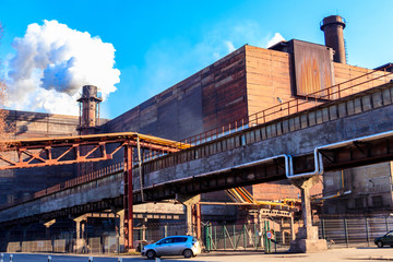 View of old factory with pipe with smoke. Air pollution, environmental damage