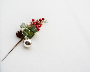 Colorful Christmas decorations isolated against real snow shot top down. 