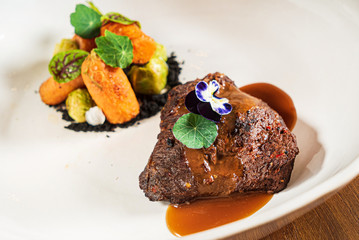 steak with vegetables and microgreens