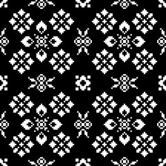 Black and white scandinavian style floral ornament with pixel embroidery effect. Seamless vector pattern for web and print, textile, wrapping paper, scrapbooking, postcards.