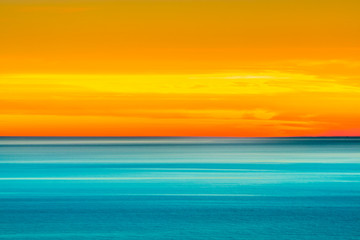 Artistic shot of sunset shot with long exposure and intentional movement photo technique. 