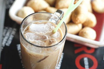 Sweet iced cappuccino coffee in big glass