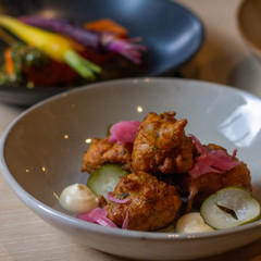 Vegetarian zucchini fritters with pickled vegetables