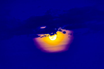 The full moon and it's halo. An artsy shot.