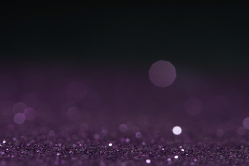 purple Sparkling Lights Festive background with texture. Abstract Christmas twinkled bright bokeh defocused and Falling stars. Winter Card or invitation.