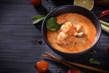 Tom Yum Goong Thai hot spicy soup with Ingredients on dark background