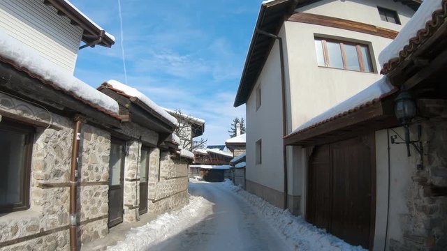 Stone pavement street in old town of Bansko, Bulgaria in winter