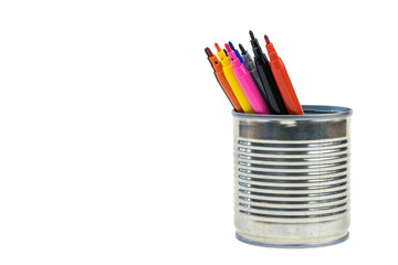 A set of multicolored markers in a tin isolated on a white background.