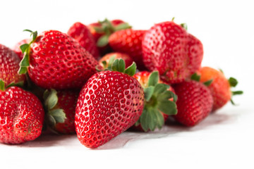 Pile of strawberries on white