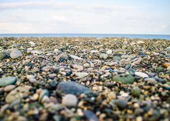 pebbles on the beach with blue sky