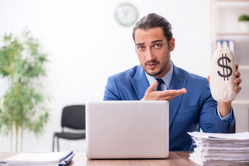 Young male businessman working in the office