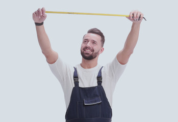 in full growth. smiling man showing construction - roulette