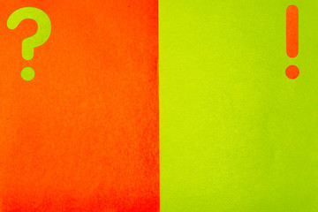 Minimalistic template with a geometric background with a question mark and an exclamation mark from multi-colored sheets of paper with a fine texture.Layout for brochures,covers,presentations.