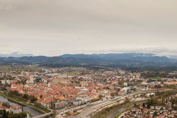 View of the old historical city Celje in Slovenia. Beautiful old city with red roofs and river Savinja nex to the city centre. 